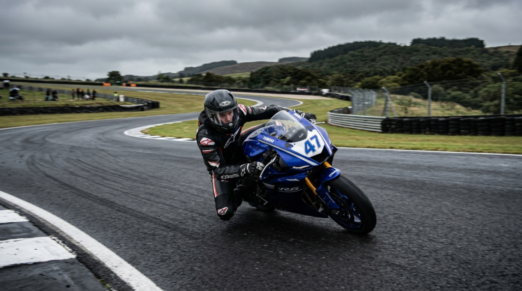 Wide-angle photograph of young motorcyclist navigating a sha